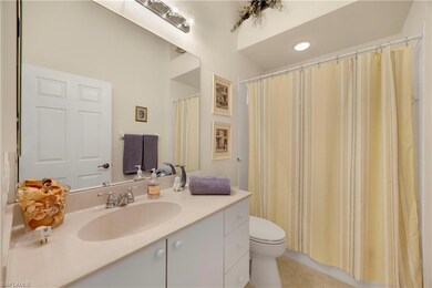 Bathroom with vanity and tile patterned flooring