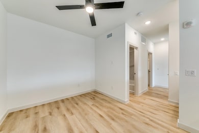 Spare room with light wood-style flooring, recessed lighting, and a ceiling fan