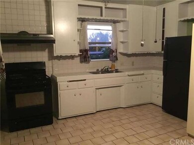Large Kitchen with real wood cabinets and tile flo