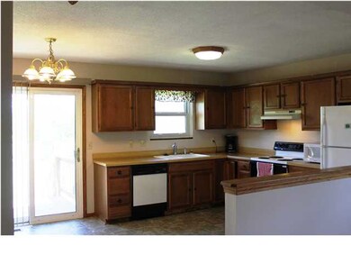 oak kitchen with new vinyl flooring