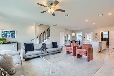 Living room featuring light marble finish floors,