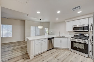 Kitchen featuring appliances with stainless steel