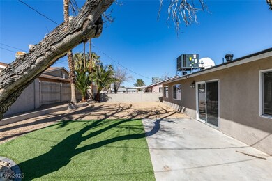 View of yard featuring a fenced backyard, cooling
