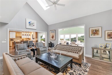 Features vaulted ceilings and opens to the kitchen