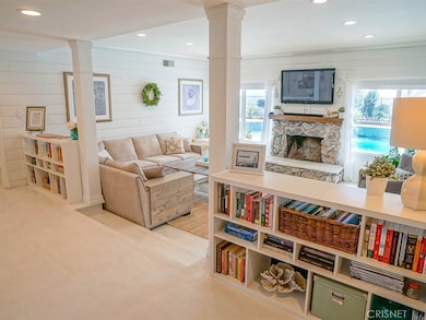 Awesome step-down living room with views of the pool & views!