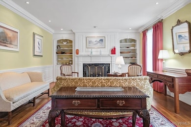Formal living room, detailed molding, hardwood flo