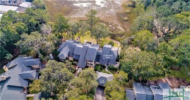 Drone view of the courtyard, decks and marsh