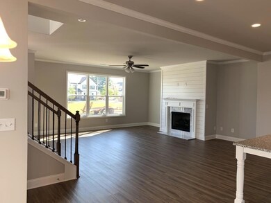 Unfurnished living room with dark wood-type floori