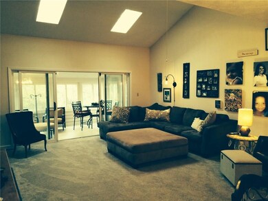 Great room with double skylights and vaulted ceiling.