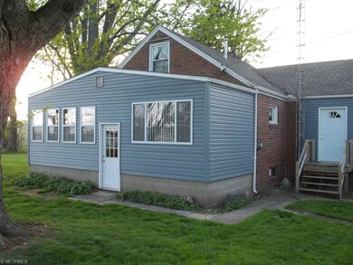 Back of home. Sun room on left.