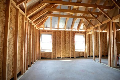 Miscellaneous room with vaulted ceiling and a weal