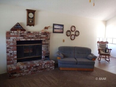 Living room and brick fireplace