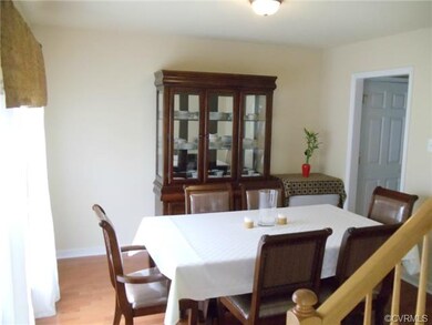 Airy and light Dining Room with plush carpet.