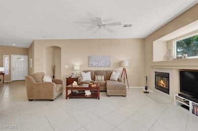 Living area featuring light tile patterned floors,