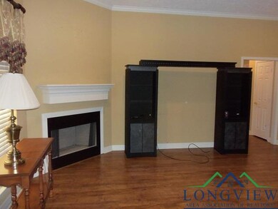 Unfurnished living room with crown molding and dar
