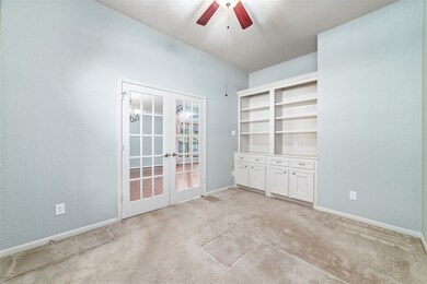 Charming study with French doors, ideal for home office or quiet reading nook.