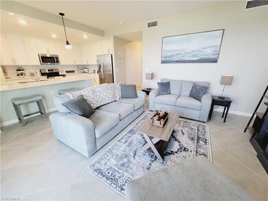 Living room with light tile patterned floors