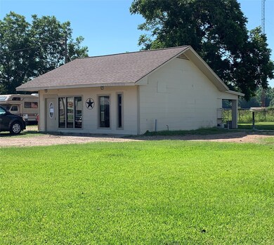 One of the buildings has bathroom and back patio w