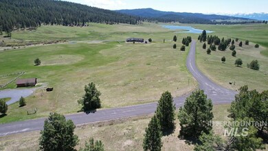 Aerial view of sparsely populated area featuring a water and mountain view