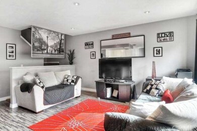 LIGHT & BRIGHT the SPACIOUS Living Room Boasts Ope