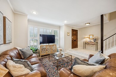 The warm and inviting living room boasts a wall of