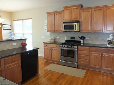 Large kitchen with hardwood floor.
