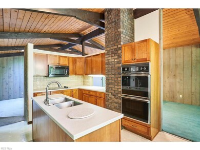 Kitchen with vaulted ceilings, cherry cabinets ove