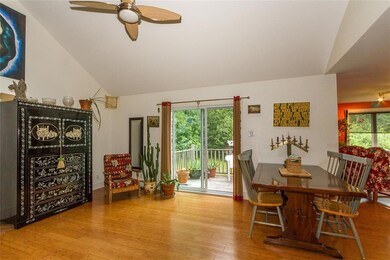 Dining room with glass sliders to...