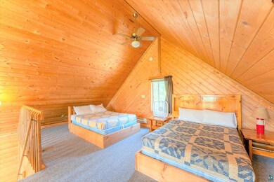 Bedroom featuring carpet floors, wooden ceiling, a