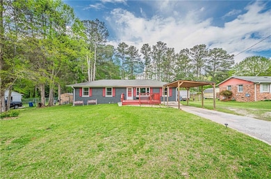 Ranch-style home featuring fence, concrete drivewa