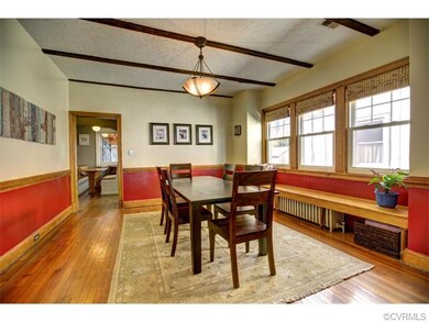 Large Dining Room with exposed beams, huge 10' win