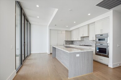 Open gourmet kitchen, where sleek custom cabinetry