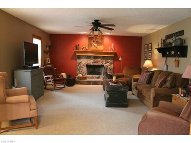 Large Family Room has woodburning fireplace w/ gas