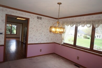 Crown molding, chair rail and wood framed doorways
