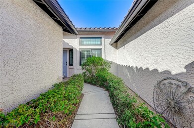 View of exterior entry featuring stucco siding