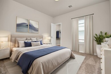 This bedroom offers warm sunlight from the large w