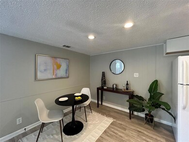 Dining space with light wood-style flooring, a te