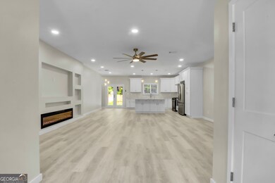 Living area featuring recessed lighting, light woo