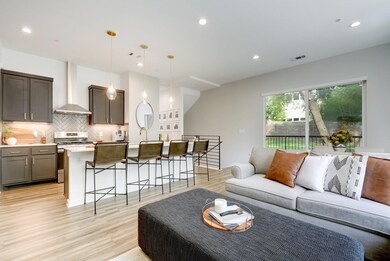 Spacious design connects the kitchen, dining, and living areas for seamless entertaining.