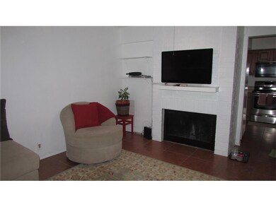 Brick fireplace in living room for cool nights.
