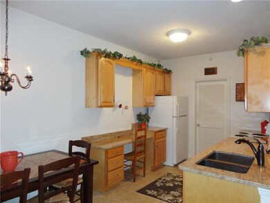 Kitchen has built in desk area and lamp. Great use