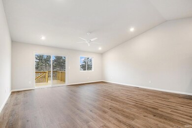 The great room & kitchen feature stunning vaulted 