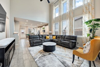 This spacious living room features high ceilings,
