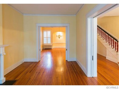 Formal living room looking into dining room.