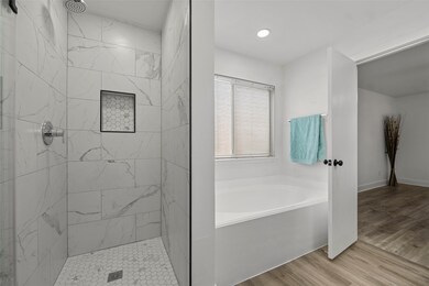 Walk-in shower and separate soaking tub.

