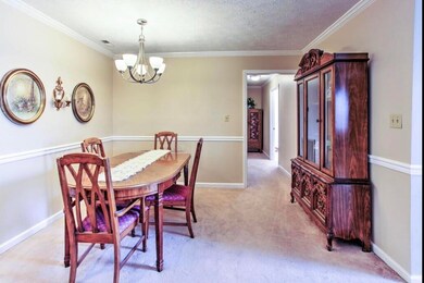 Dining room features crown molding