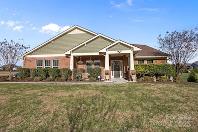 Brick and freshly painted hardboard siding exterior adds timeless curb appeal