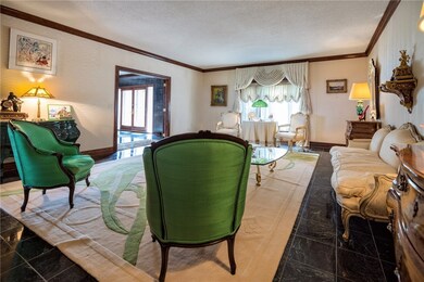 Spacious living room with granite tile floors and