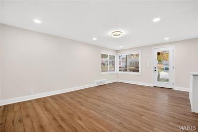 Spare room featuring recessed lighting and light wood finished floors