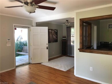 The living room is also open to the dining room and kitchen with a storm door to look outside!